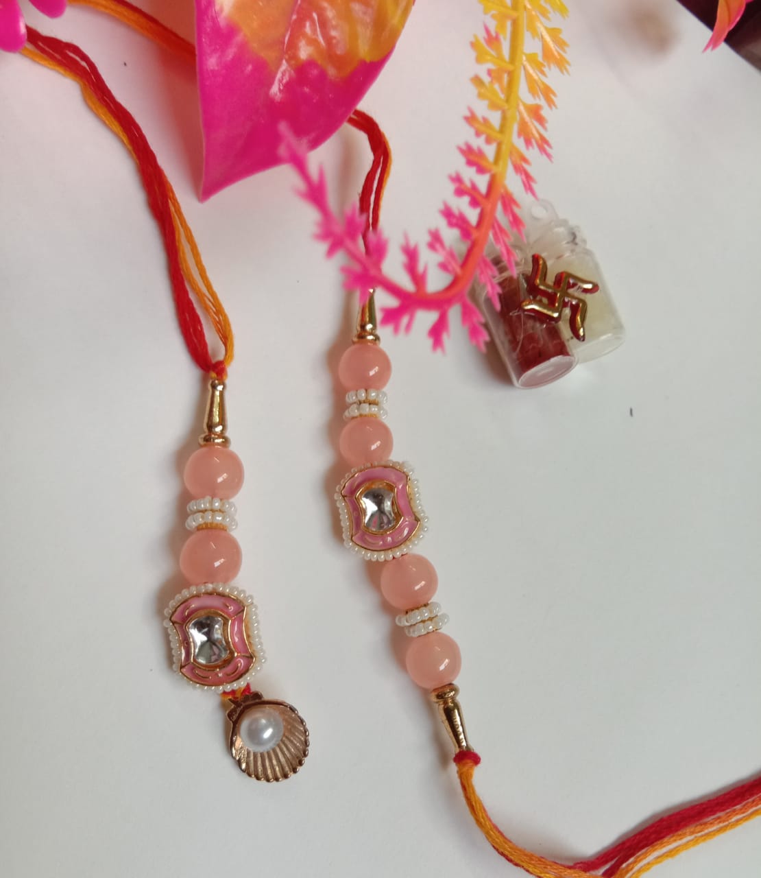 PREMIUM PAIR RAKHI WITH SET OF TWO RAKHIES.