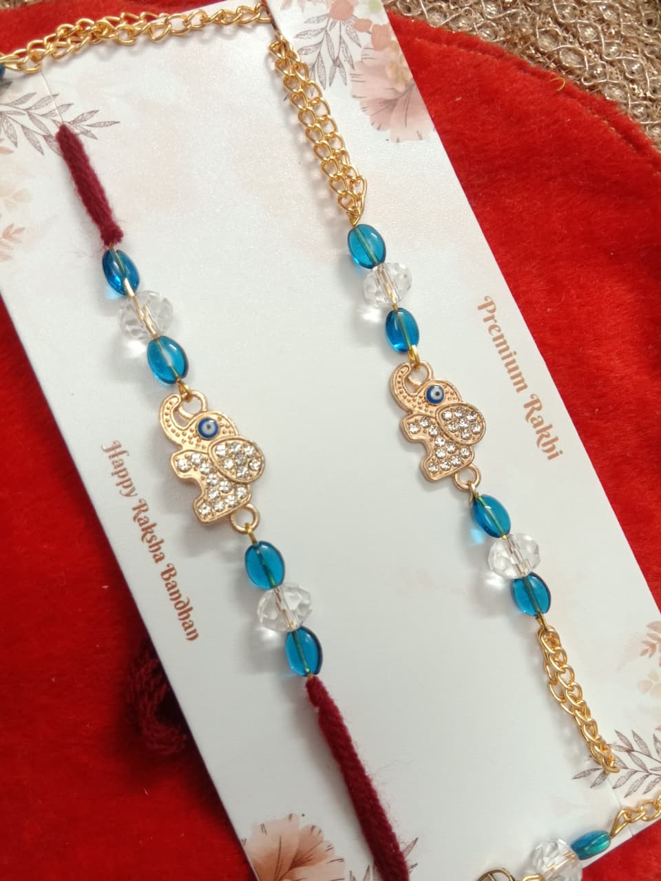 PREMIUM KUNDAN PAIR RAKHI WITH SET OF TWO RAKHIES.